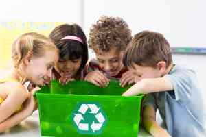 curious kids looking into a bin